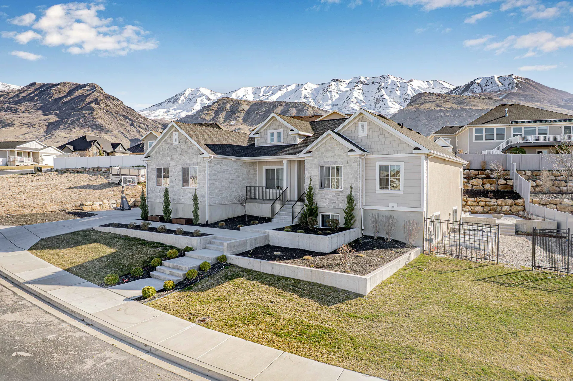A Signal Creative listing in a Utah foothill neighborhood, snow-capped Wasatch peaks behind.